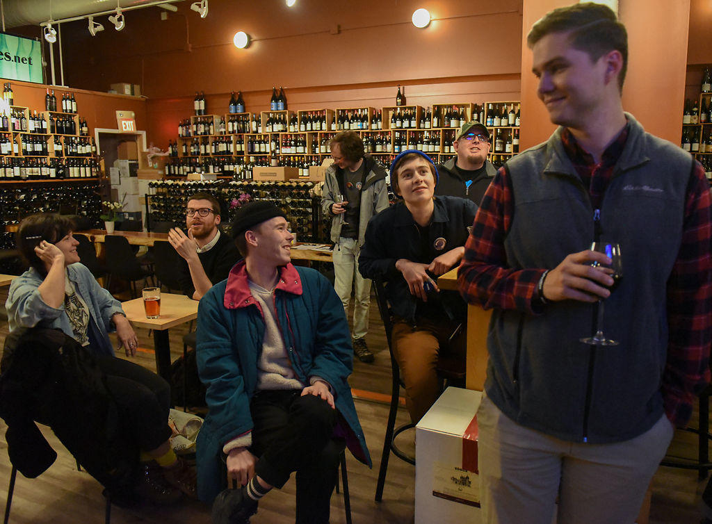 Bernie Sanders supporters gather to watch the Democratic debate